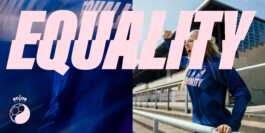 Pink EQUALITY print on the blue Fan for Female jersey, woman in a stadium behind 